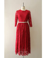A long dress made entirely of lace and featuring a red dahlia (with belt)