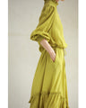 Pistachio color long dress with ruffled diagonal hem (with ribbon)