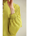 Pistachio color long dress with ruffled diagonal hem (with ribbon)