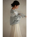 Fleece-lined pullover top with flowing white floral lace