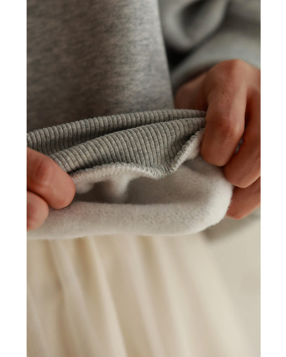 Fleece-lined pullover top with flowing white floral lace