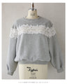 Fleece-lined pullover top with flowing white floral lace