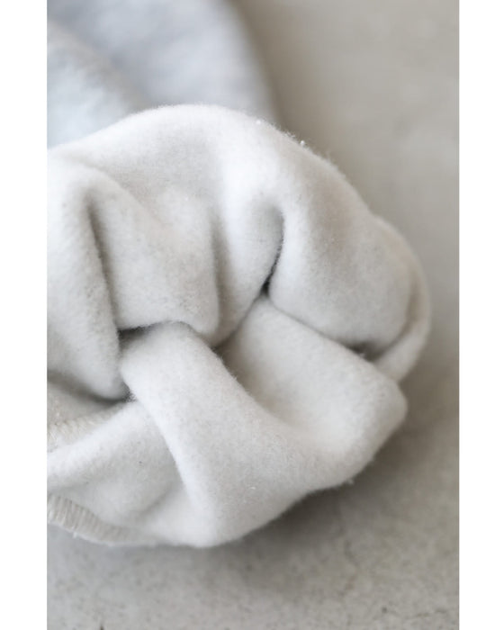 Fleece-lined pullover top with flowing white floral lace