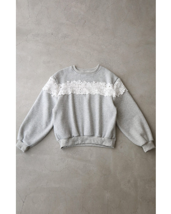 Fleece-lined pullover top with flowing white floral lace