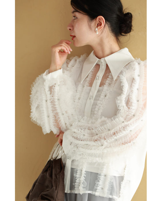 たっぷりフリルとビジュー流れるシアーブラウストップス