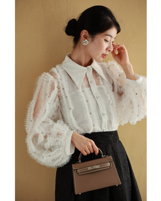 たっぷりフリルとビジュー流れるシアーブラウストップス