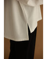 A pullover top with three-dimensional rose lace that brightens up the décolletage
