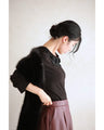 A pullover top with three-dimensional rose lace that brightens up the décolletage