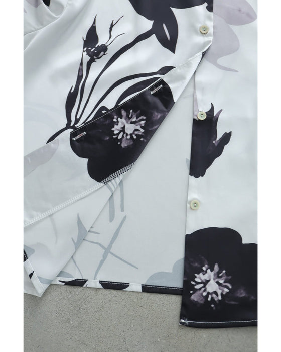モノトーンの花を描くとろみブラウストップス