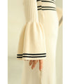 A cute, flare-sleeved knit medium-length dress