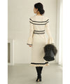 A cute, flare-sleeved knit medium-length dress