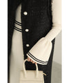 A cute, flare-sleeved knit medium-length dress