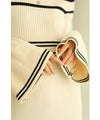 A cute, flare-sleeved knit medium-length dress