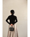 (Black) Sparkling black floral knit top with bejeweled lines