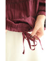 Gathered pullover top with back button