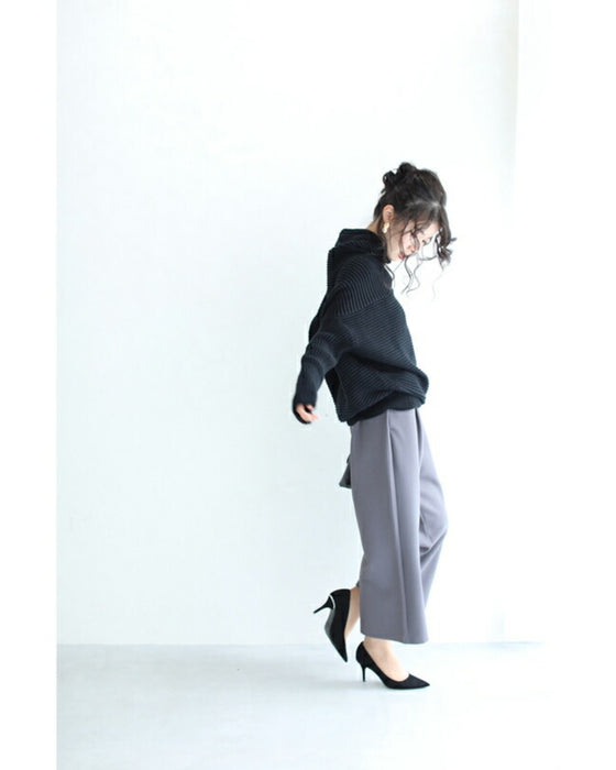 A long knit top with a unique silhouette