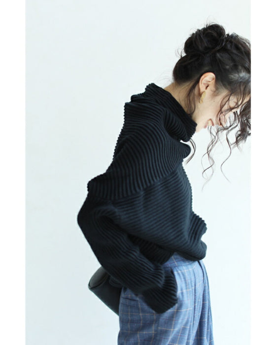 A long knit top with a unique silhouette