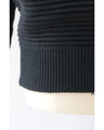 A long knit top with a unique silhouette