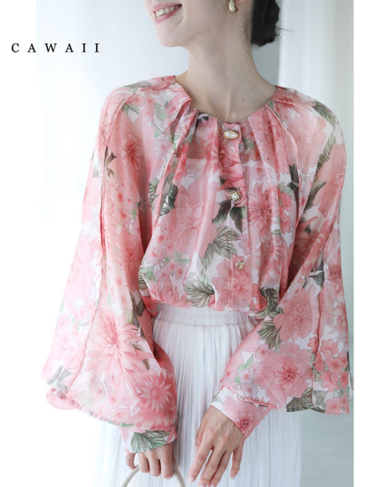 A sheer tunic top with a soft silhouette perfect for spring