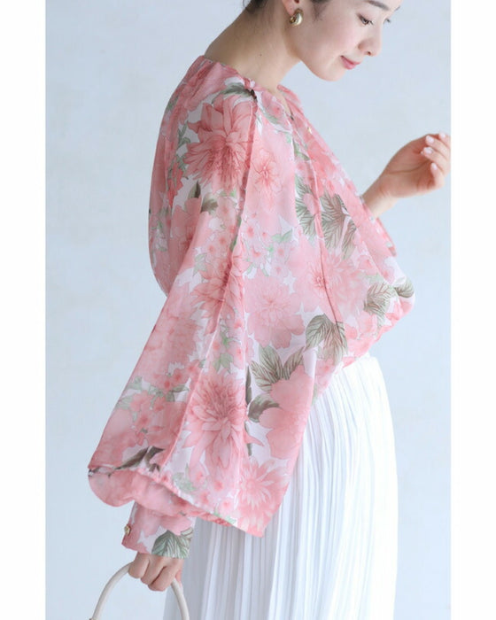 A sheer tunic top with a soft silhouette perfect for spring