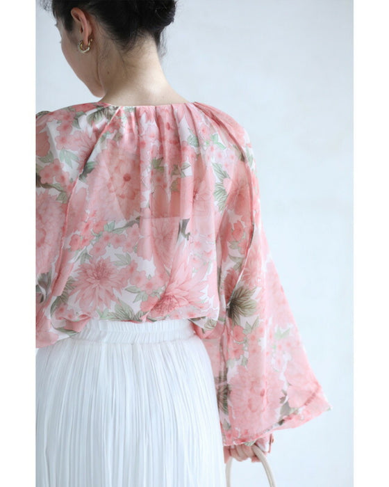 A sheer tunic top with a soft silhouette perfect for spring