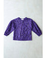 An elegant blouson with an embroidered veil that blooms all over