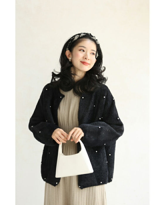 A twisted headband made of different materials and decorated with jewels