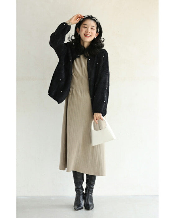 A twisted headband made of different materials and decorated with jewels