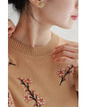 舞うような枝花刺繍のニットプルオーバートップス