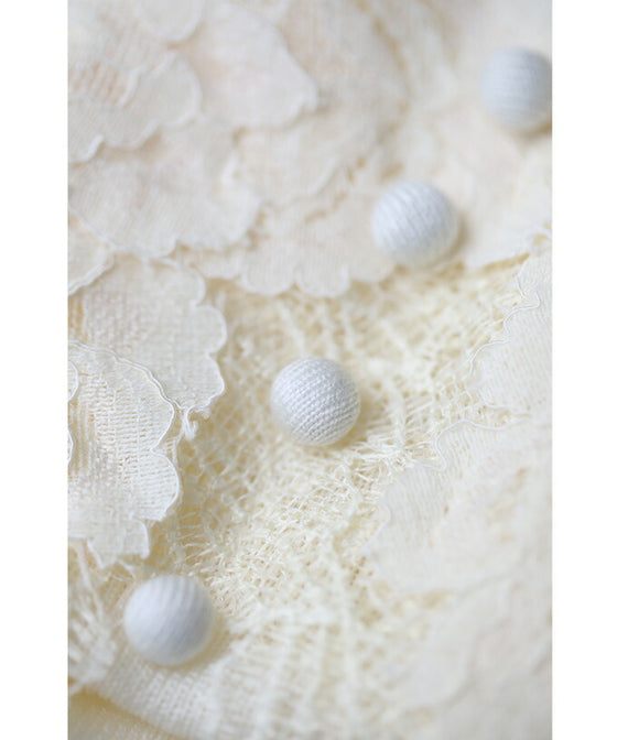 A cut-and-sew top with plenty of floral lace that blooms in a three-dimensional way