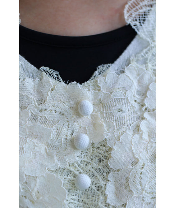 A cut-and-sew top with plenty of floral lace that blooms in a three-dimensional way