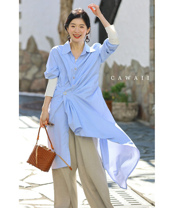 Asymmetrical draped shirt tunic fluttering in the fresh breeze