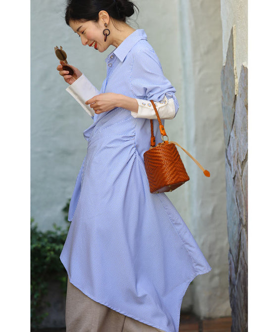 Asymmetrical draped shirt tunic fluttering in the fresh breeze