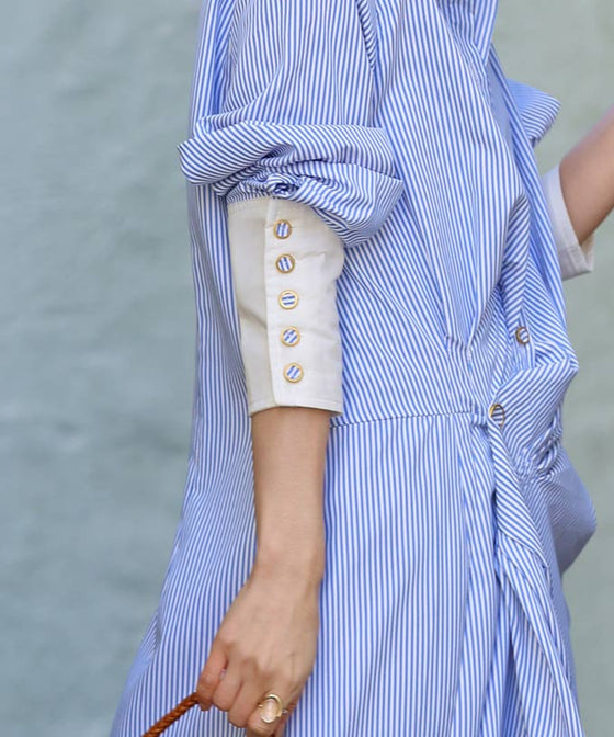 Asymmetrical draped shirt tunic fluttering in the fresh breeze