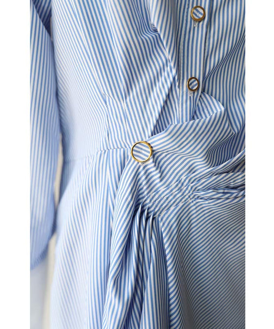 Asymmetrical draped shirt tunic fluttering in the fresh breeze