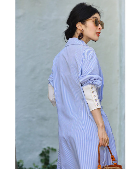 Asymmetrical draped shirt tunic fluttering in the fresh breeze