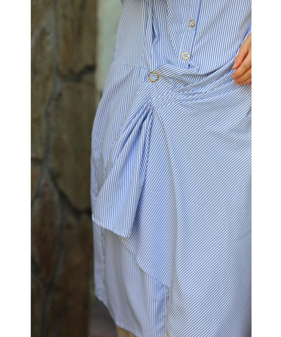 Asymmetrical draped shirt tunic fluttering in the fresh breeze