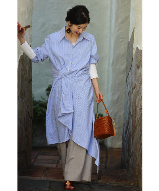 Asymmetrical draped shirt tunic fluttering in the fresh breeze