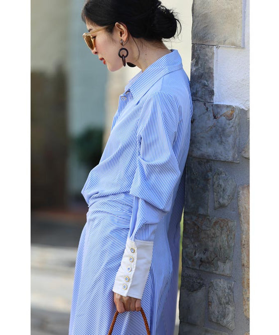 Asymmetrical draped shirt tunic fluttering in the fresh breeze
