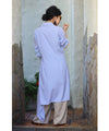Asymmetrical draped shirt tunic fluttering in the fresh breeze