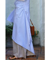Asymmetrical draped shirt tunic fluttering in the fresh breeze