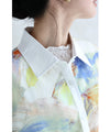 A watercolor art shirt dress with an asymmetrical design that captivates on both sides