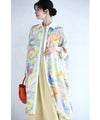 A watercolor art shirt dress with an asymmetrical design that captivates on both sides