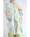 A watercolor art shirt dress with an asymmetrical design that captivates on both sides