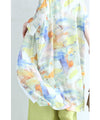 A watercolor art shirt dress with an asymmetrical design that captivates on both sides