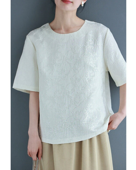 Pullover top with floating leaf pattern and relief effect