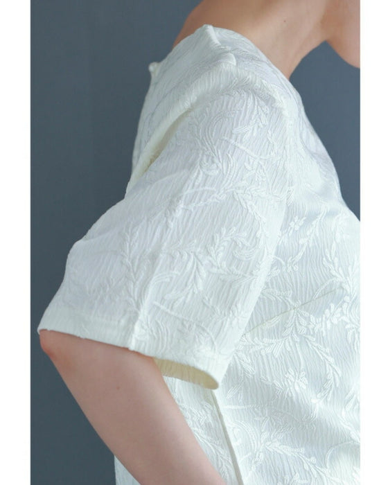 Pullover top with floating leaf pattern and relief effect