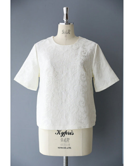 Pullover top with floating leaf pattern and relief effect