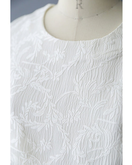 Pullover top with floating leaf pattern and relief effect
