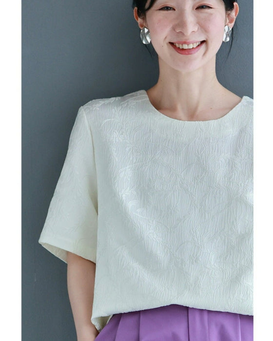 Pullover top with floating leaf pattern and relief effect